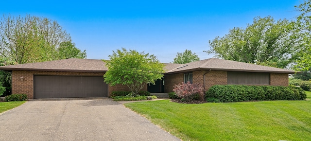 7298 Vista, Stillman Valley, IL 61084 - view of front of house featuring brick siding, driveway, a garage, and a front lawn