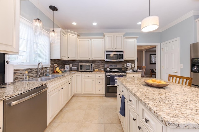 6 Conway Cir, Bloomington, IL 61704 - kitchen featuring appliances with stainless steel finishes, a sink, tasteful backsplash, ornamental molding, and light stone counters