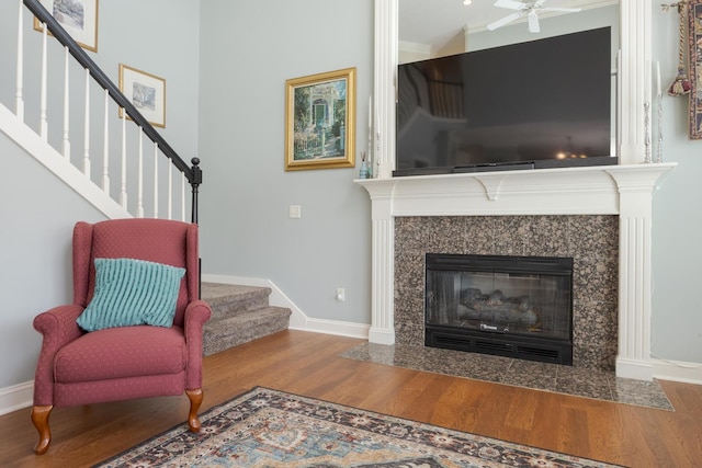 6 Conway Cir, Bloomington, IL 61704 - living area with wood finished floors, baseboards, stairs, ceiling fan, and a high end fireplace