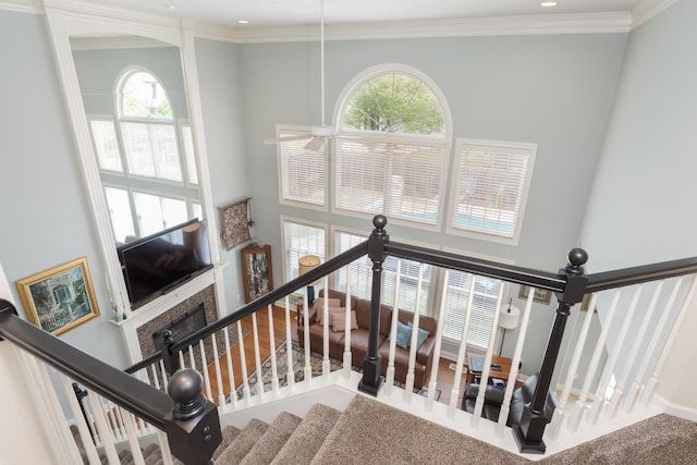 6 Conway Cir, Bloomington, IL 61704 - staircase with a towering ceiling, healthy amount of natural light, a fireplace, crown molding, and recessed lighting