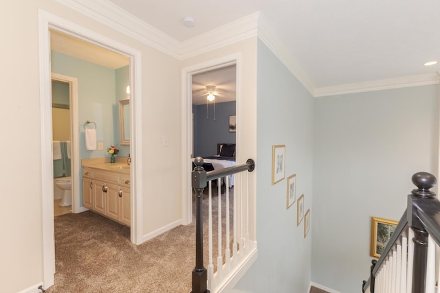 6 Conway Cir, Bloomington, IL 61704 - corridor featuring an upstairs landing, crown molding, carpet floors, a sink, and baseboards