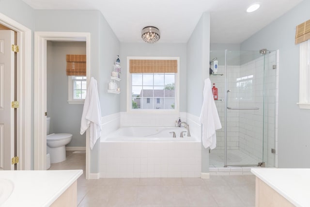 6 Conway Cir, Bloomington, IL 61704 - full bath featuring vanity, a stall shower, a bath, toilet, and tile patterned floors