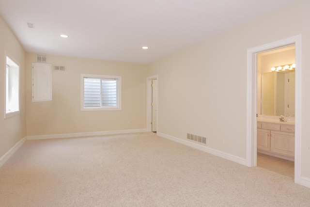 6 Conway Cir, Bloomington, IL 61704 - unfurnished room with light colored carpet, a sink, recessed lighting, and baseboards