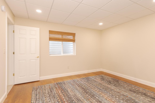 6 Conway Cir, Bloomington, IL 61704 - unfurnished room featuring wood finished floors, baseboards, a drop ceiling, and recessed lighting