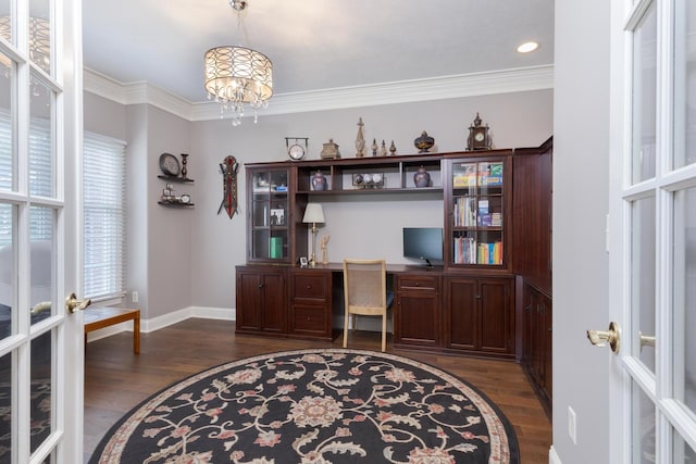 6 Conway Cir, Bloomington, IL 61704 - office area featuring french doors, baseboards, dark wood finished floors, built in study area, and crown molding