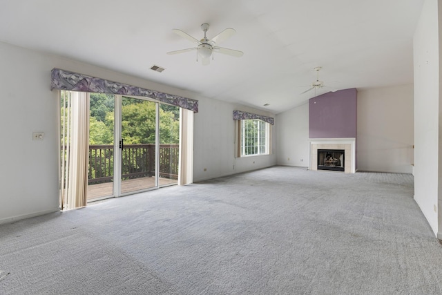1985 Blackberry Ln Unit 1985, Hoffman Estates, IL 60169 - unfurnished living room featuring a ceiling fan, carpet floors, vaulted ceiling, and a tile fireplace
