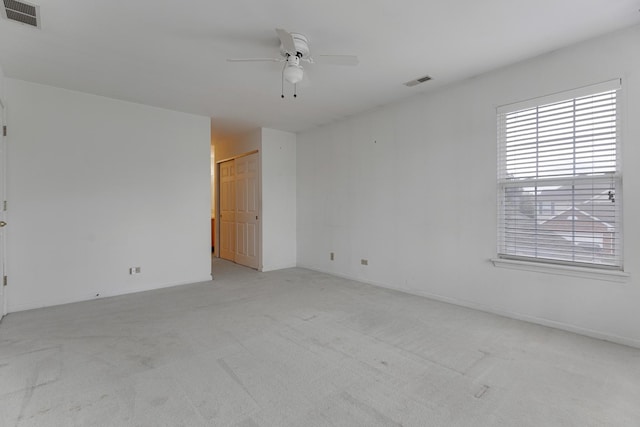 1985 Blackberry Ln Unit 1985, Hoffman Estates, IL 60169 - spare room with a ceiling fan, light colored carpet, and baseboards
