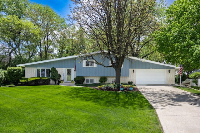 1723 Columbine Dr, Schaumburg, IL 60173 - view of front of property featuring brick siding, an attached garage, driveway, and a front yard