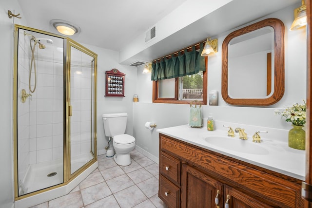 1723 Columbine Dr, Schaumburg, IL 60173 - full bathroom featuring toilet, a stall shower, tile patterned flooring, vanity, and baseboards