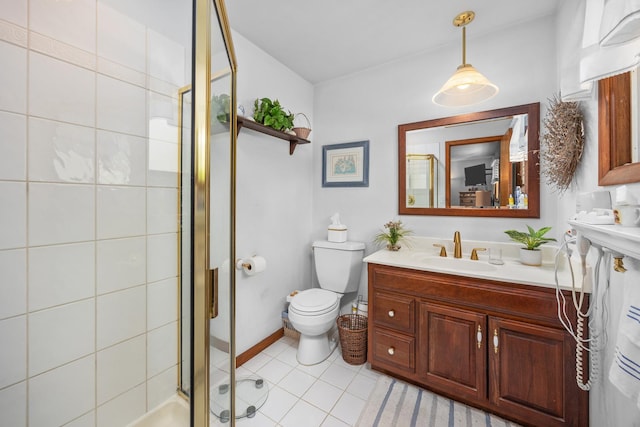 1723 Columbine Dr, Schaumburg, IL 60173 - bathroom featuring a sink, a stall shower, toilet, tile patterned flooring, and baseboards
