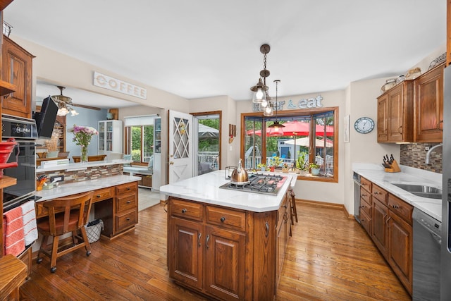1723 Columbine Dr, Schaumburg, IL 60173 - kitchen with stainless steel appliances, a sink, hardwood / wood-style floors, backsplash, and ceiling fan