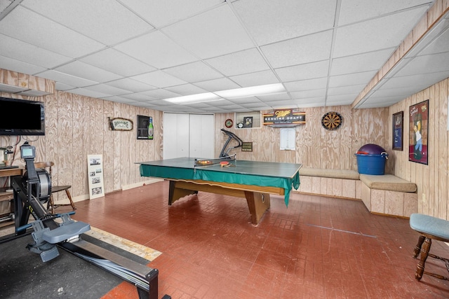 1723 Columbine Dr, Schaumburg, IL 60173 - recreation room featuring a paneled ceiling, wooden walls, and baseboards