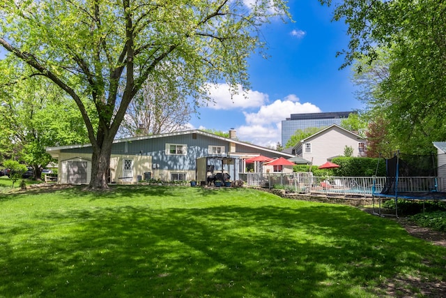 1723 Columbine Dr, Schaumburg, IL 60173 - back of house with a trampoline and a chimney