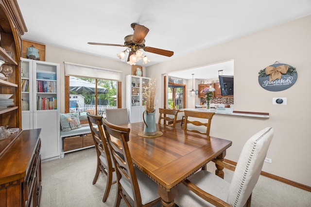 1723 Columbine Dr, Schaumburg, IL 60173 - dining room featuring light carpet, a ceiling fan, and baseboards