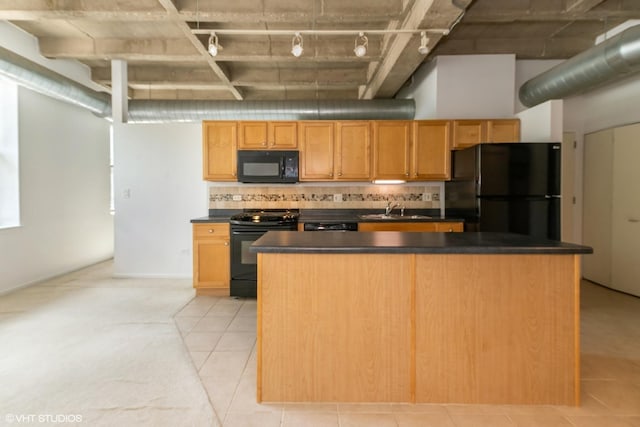 5200 S Ellis Ave Unit 211, Chicago, IL 60615 - kitchen with black appliances, track lighting, a sink, dark countertops, and tasteful backsplash