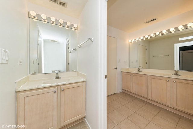 5200 S Ellis Ave Unit 211, Chicago, IL 60615 - bathroom featuring tile patterned floors and double vanity