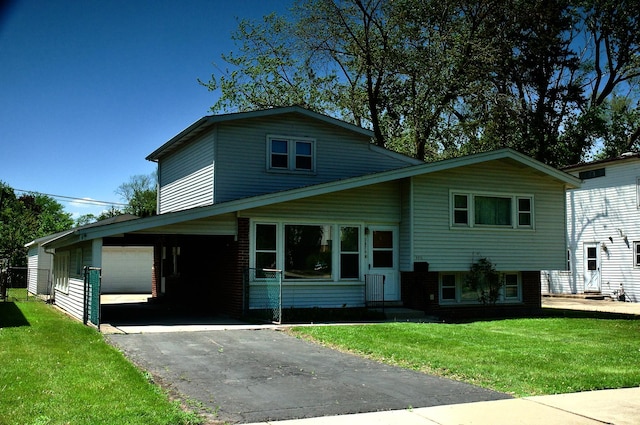 2876 S Scott St, Des Plaines, IL 60018 - split level home featuring a front lawn, asphalt driveway, entry steps, and a garage