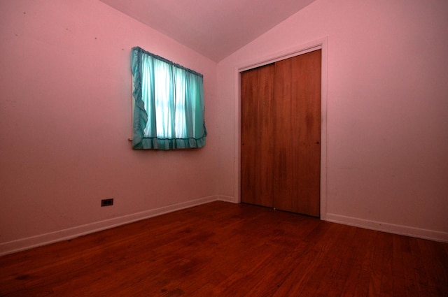 2876 S Scott St, Des Plaines, IL 60018 - unfurnished bedroom with vaulted ceiling, wood finished floors, a closet, and baseboards