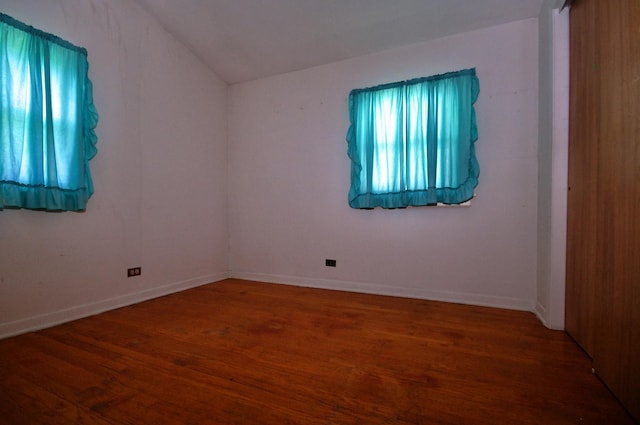 2876 S Scott St, Des Plaines, IL 60018 - unfurnished room with wood finished floors, vaulted ceiling, and baseboards