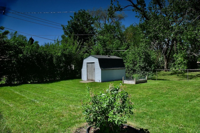2876 S Scott St, Des Plaines, IL 60018 - view of yard featuring a storage unit, a vegetable garden, and an outdoor structure