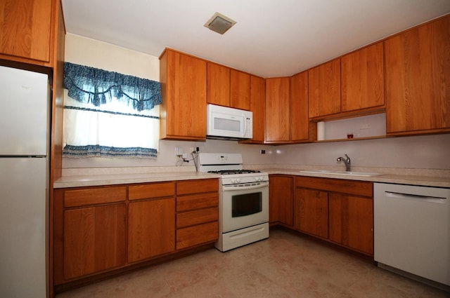 2876 S Scott St, Des Plaines, IL 60018 - kitchen with white appliances, a sink, light countertops, and brown cabinetry