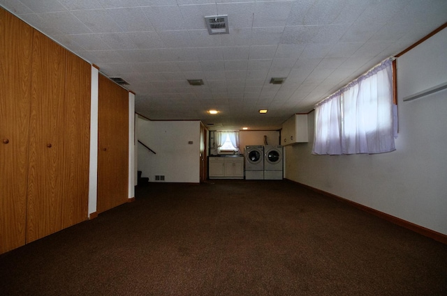 2876 S Scott St, Des Plaines, IL 60018 - below grade area featuring washing machine and clothes dryer, dark colored carpet, and stairway