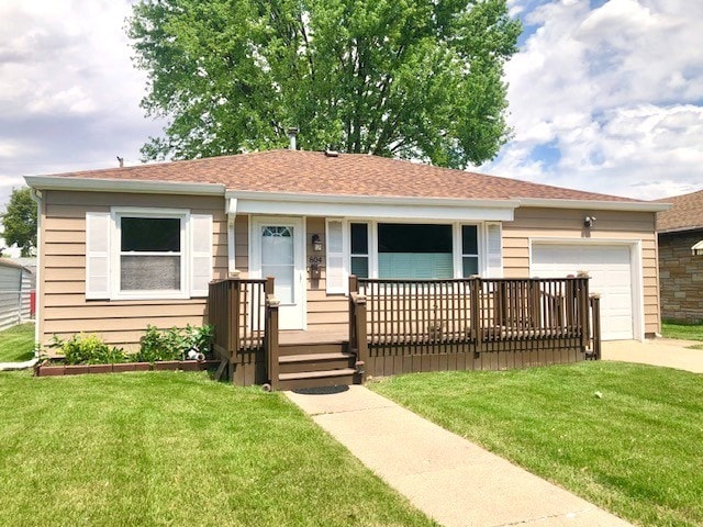 ranch-style house with a garage, a front yard, and a porch
