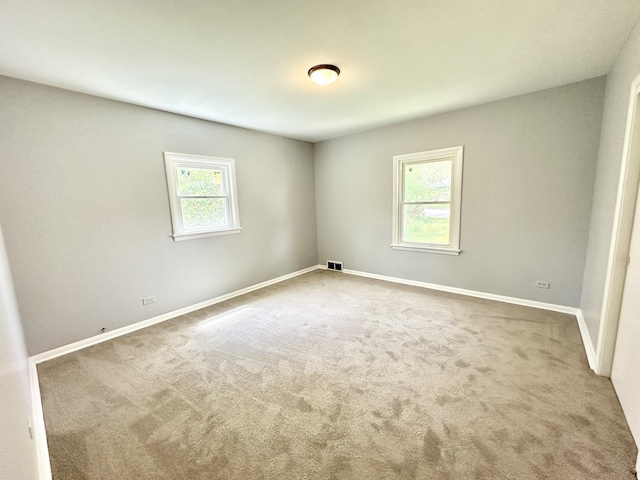301 Illinois Ave, Elgin, IL 60120 - carpeted empty room featuring baseboards