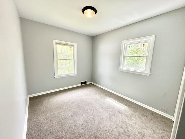 301 Illinois Ave, Elgin, IL 60120 - carpeted empty room with baseboards