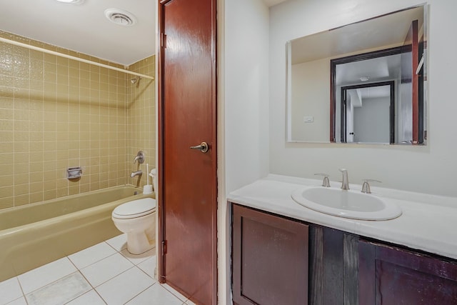 bathroom featuring tile patterned flooring, toilet, shower / washtub combination, and vanity