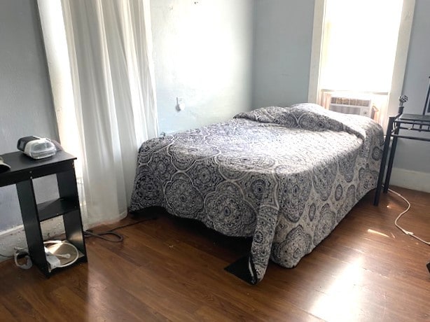 bedroom featuring wood finished floors