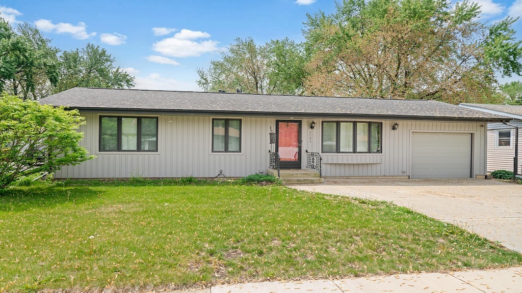 2103 Maple Ave, Loves Park, IL 61111 - ranch-style house featuring a garage, driveway, a front lawn, and a shingled roof