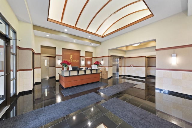 6420 Double Eagle Dr Unit 512, Woodridge, IL 60517 - welcome area with a wainscoted wall, tile walls, recessed lighting, and high vaulted ceiling