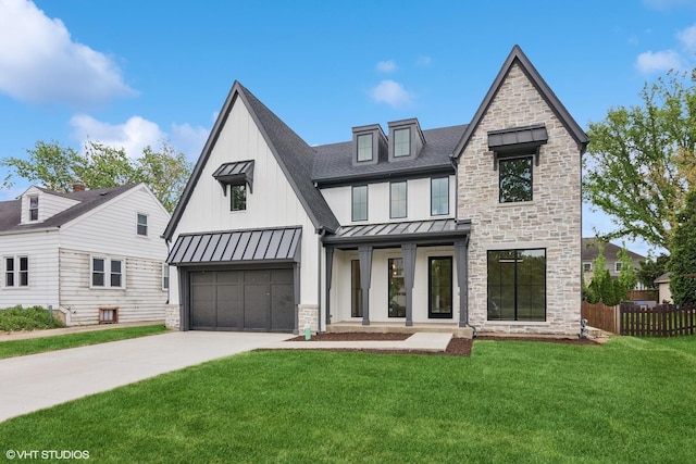 613 S Chatham Ave, Elmhurst, IL 60126 - view of front facade with a standing seam roof, concrete driveway, stone siding, roof with shingles, and a garage