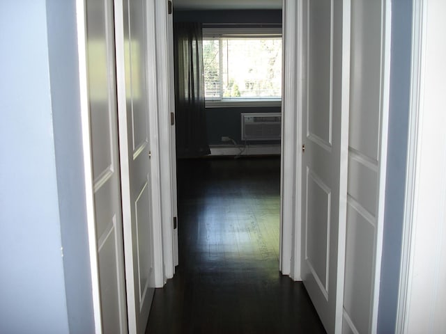 hall with dark wood-style flooring