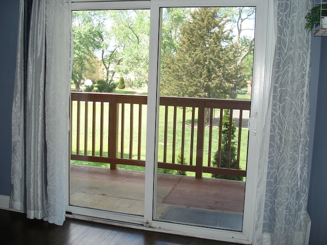 doorway to outside featuring wood finished floors