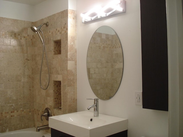 bathroom featuring vanity and tub / shower combination