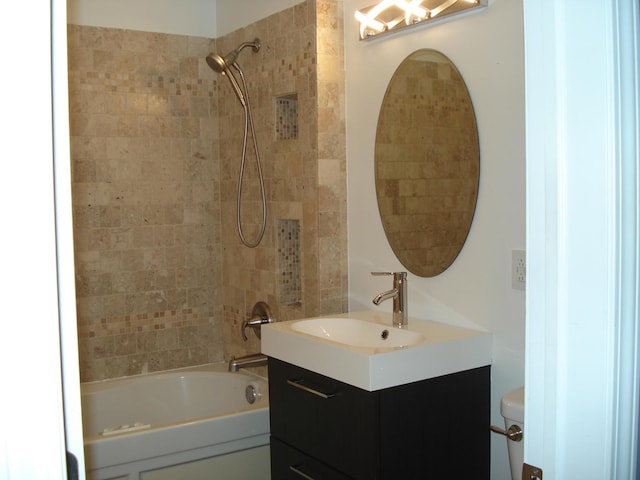 bathroom with vanity, toilet, and bathing tub / shower combination