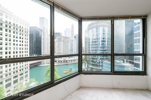 405 N Wabash Ave Unit 807, Chicago, IL 60611 - unfurnished sunroom with a view of city and a water view