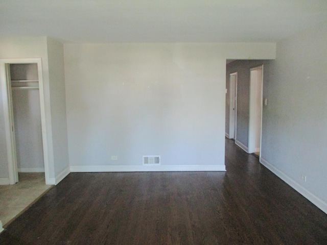 9029 S Crandon Ave, Chicago, IL 60617 - unfurnished bedroom with wood finished floors, baseboards, and a closet