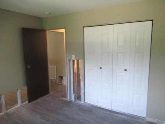 10429 Austin Ave Unit A, Oak Lawn, IL 60453 - unfurnished bedroom with wood finished floors and a closet