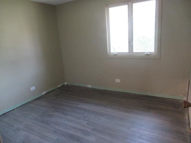 10429 Austin Ave Unit A, Oak Lawn, IL 60453 - unfurnished room with wood finished floors and baseboards