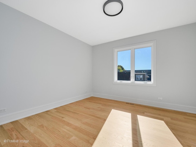 2535 W Belden Ave, Chicago, IL 60647 - spare room with baseboards and light wood-style flooring