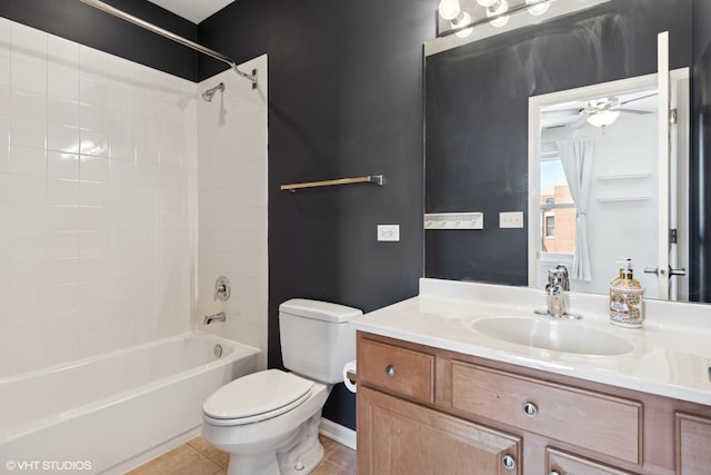 full bathroom with toilet,  shower combination, vanity, tile patterned floors, and a ceiling fan