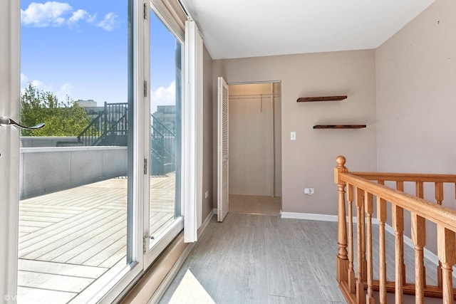 interior space featuring wood finished floors and baseboards