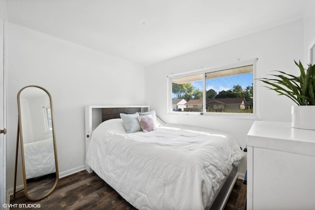 812 Sumac Dr, Streamwood, IL 60107 - bedroom featuring dark wood-type flooring and baseboards
