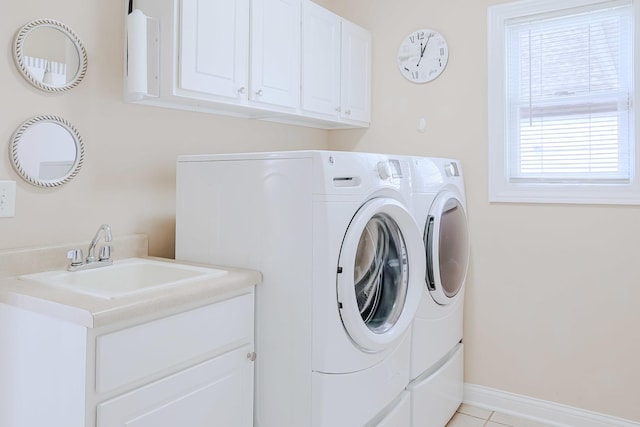 8834 Doubletree Dr N, Crown Point, IN 46307 - laundry area with washing machine and dryer, cabinet space, and baseboards