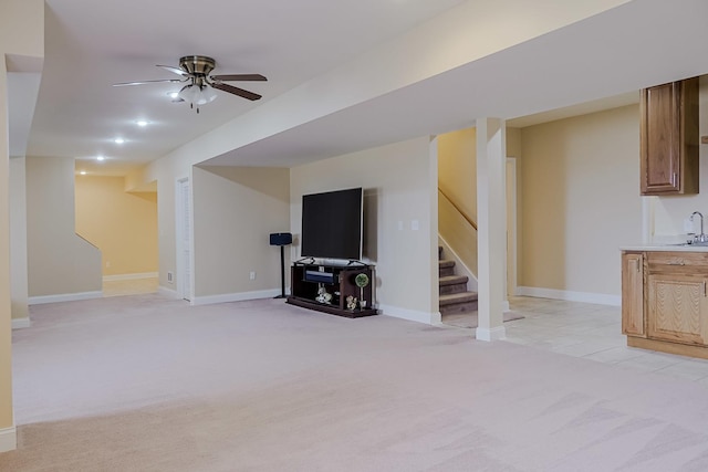 8834 Doubletree Dr N, Crown Point, IN 46307 - finished below grade area with light colored carpet, stairway, a sink, a ceiling fan, and baseboards