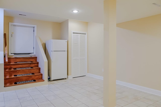 8834 Doubletree Dr N, Crown Point, IN 46307 - kitchen featuring freestanding refrigerator, recessed lighting, light tile patterned floors, and baseboards