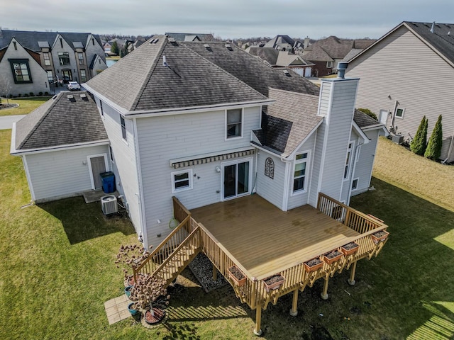 8834 Doubletree Dr N, Crown Point, IN 46307 - back of property with central AC unit, a chimney, a shingled roof, a wooden deck, and a residential view